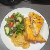 Cheese & Ham Toasties Served With Salad Garnish & Crisps
