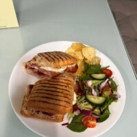 Cheese & Ham Paninis Served With Salad Garnish & Crisps